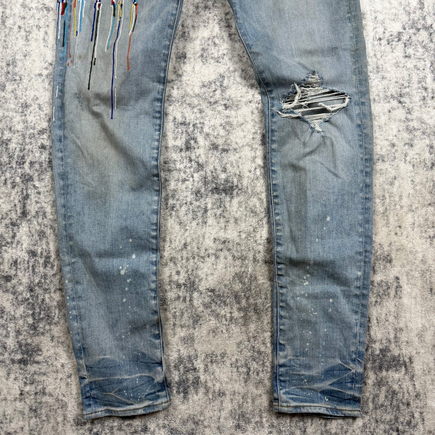 AMIRI Paint Drip Logo Skinny Jeans Light Indigo