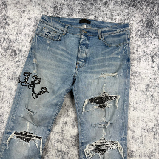 Amiri Old English Logo ‘Clay/Indigo’ Jeans