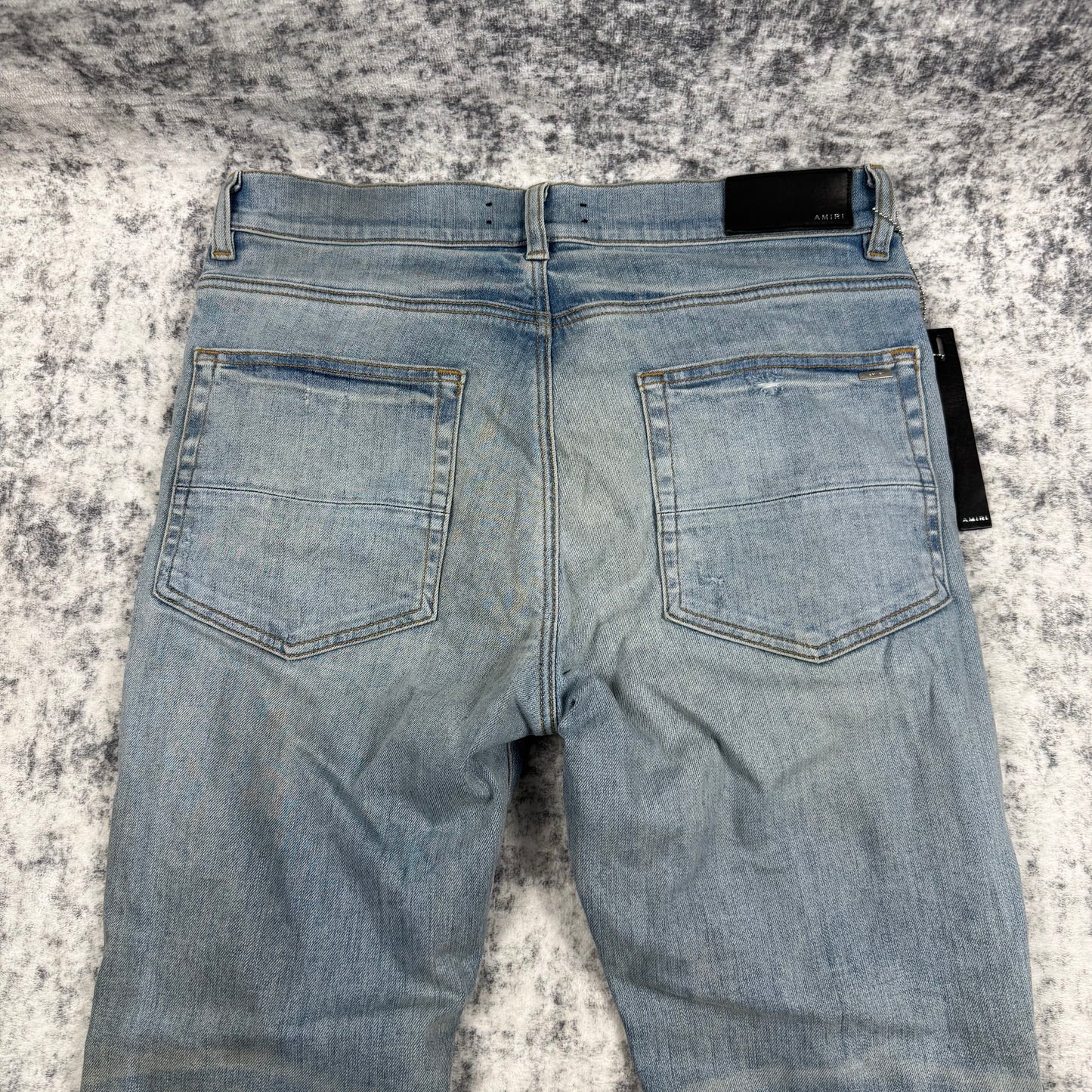 AMIRI Paint Drip Logo Skinny Jeans Light Indigo