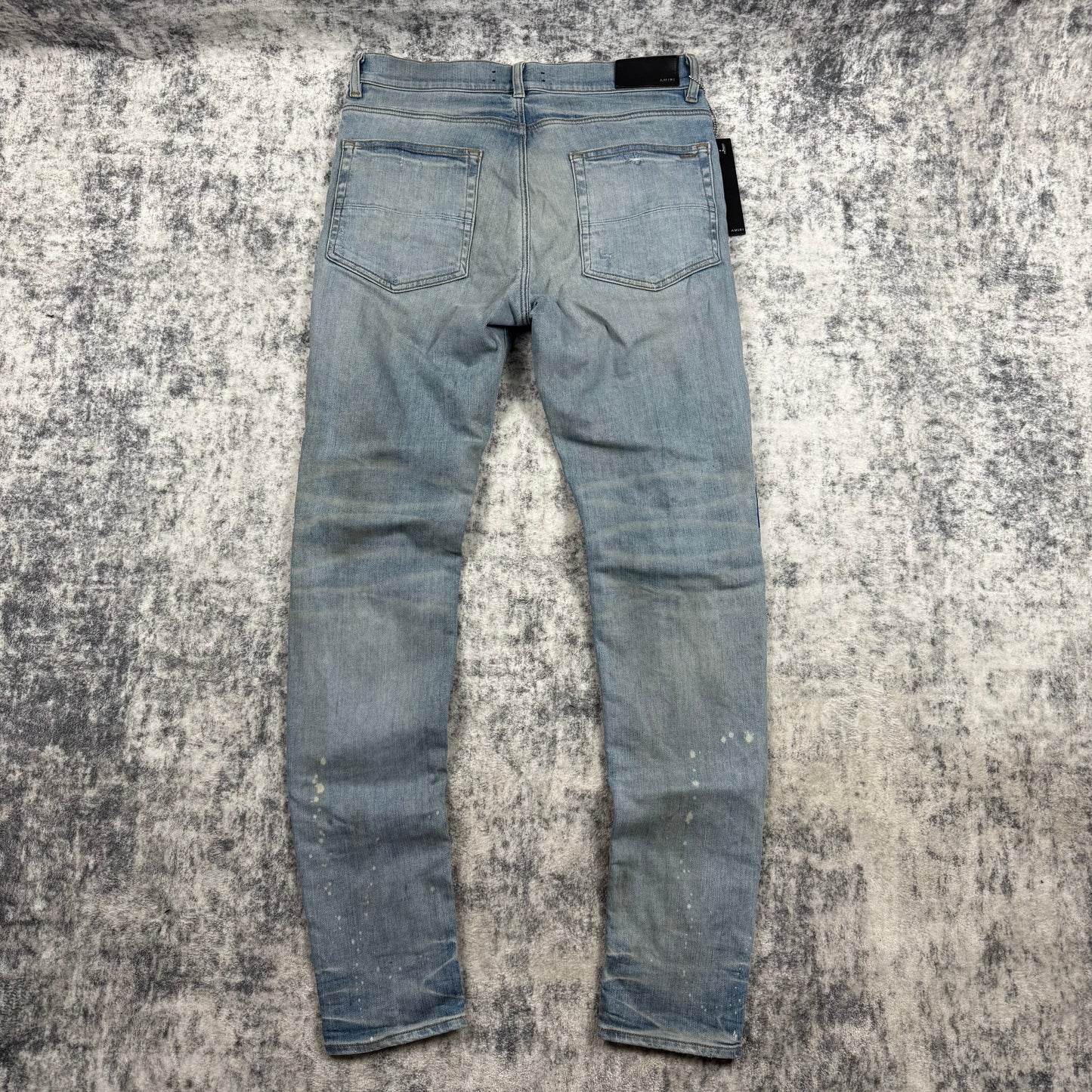 AMIRI Paint Drip Logo Skinny Jeans Light Indigo